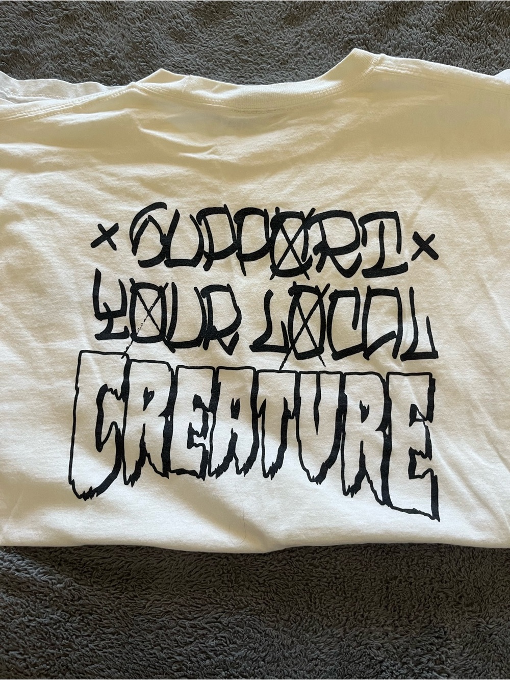 Vintage White Graphic Tee "Support Your Local Creature"